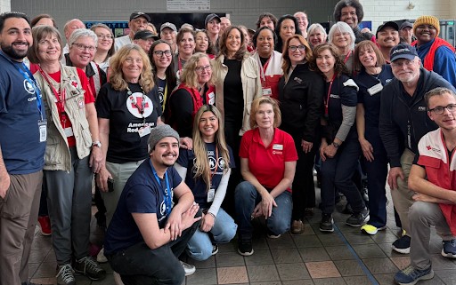 Photo of Kamala Harris with a large group of Red Cross first responders